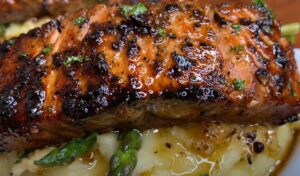 Pan-seared salmon fillet, glistening with a rich glaze